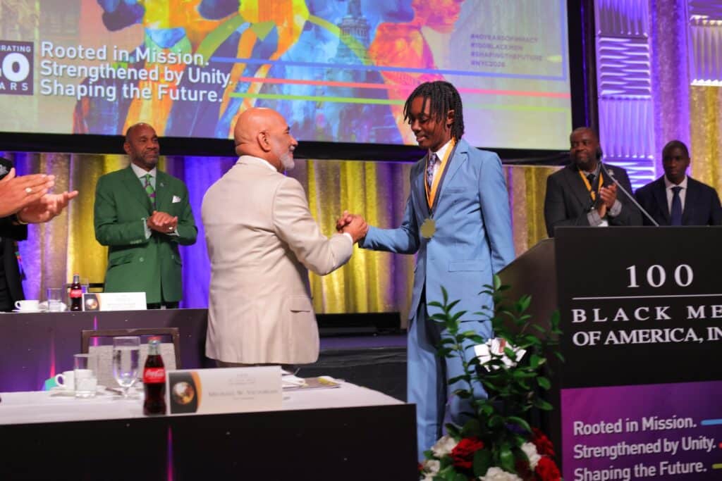 A young leader receiving recognition on stage
